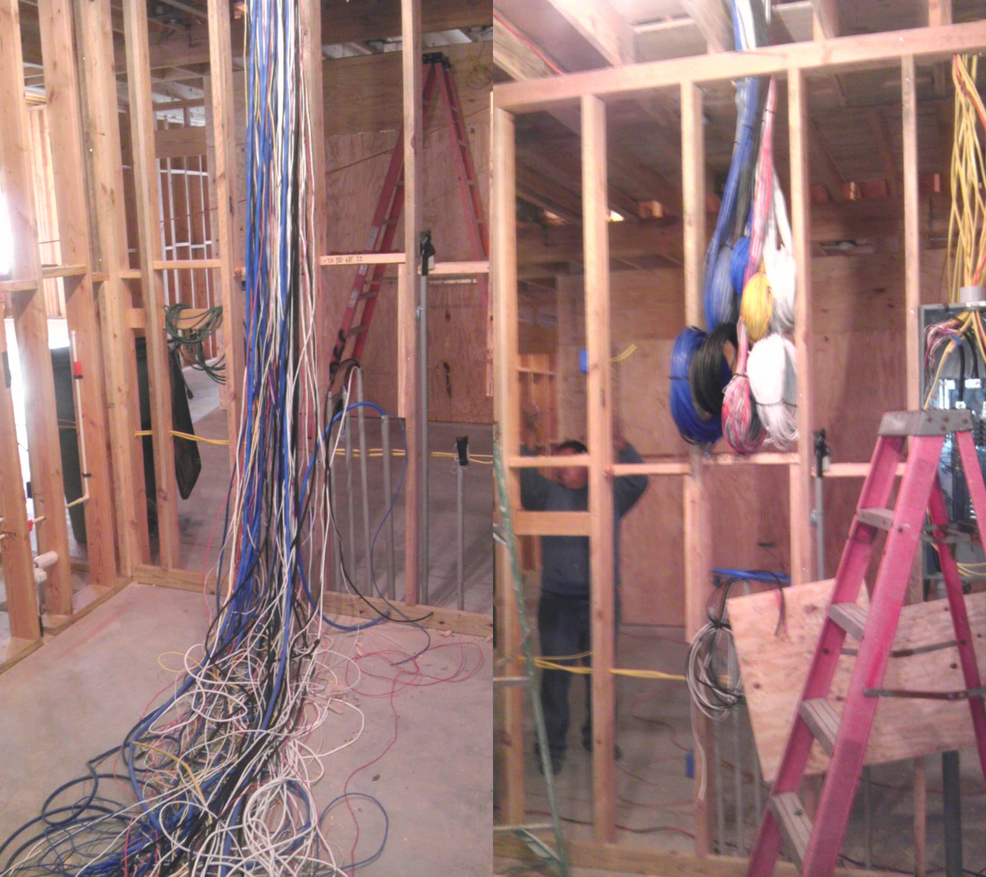 Construction site with exposed wooden framing and electrical wiring installation in progress.